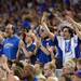 Kansas fans celebrate a play during the second half at Cowboys Stadium in Arlington, Texas on March 29, 2013. Melanie Maxwell I AnnArbor.com